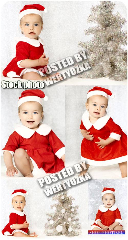 Маленькая девочка у новогодней елки / Little girl at a christmas tree - stock photo