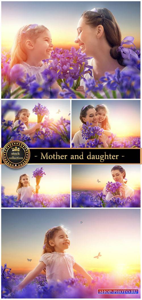 Mother and daughter on the field with iris - Stock Photo